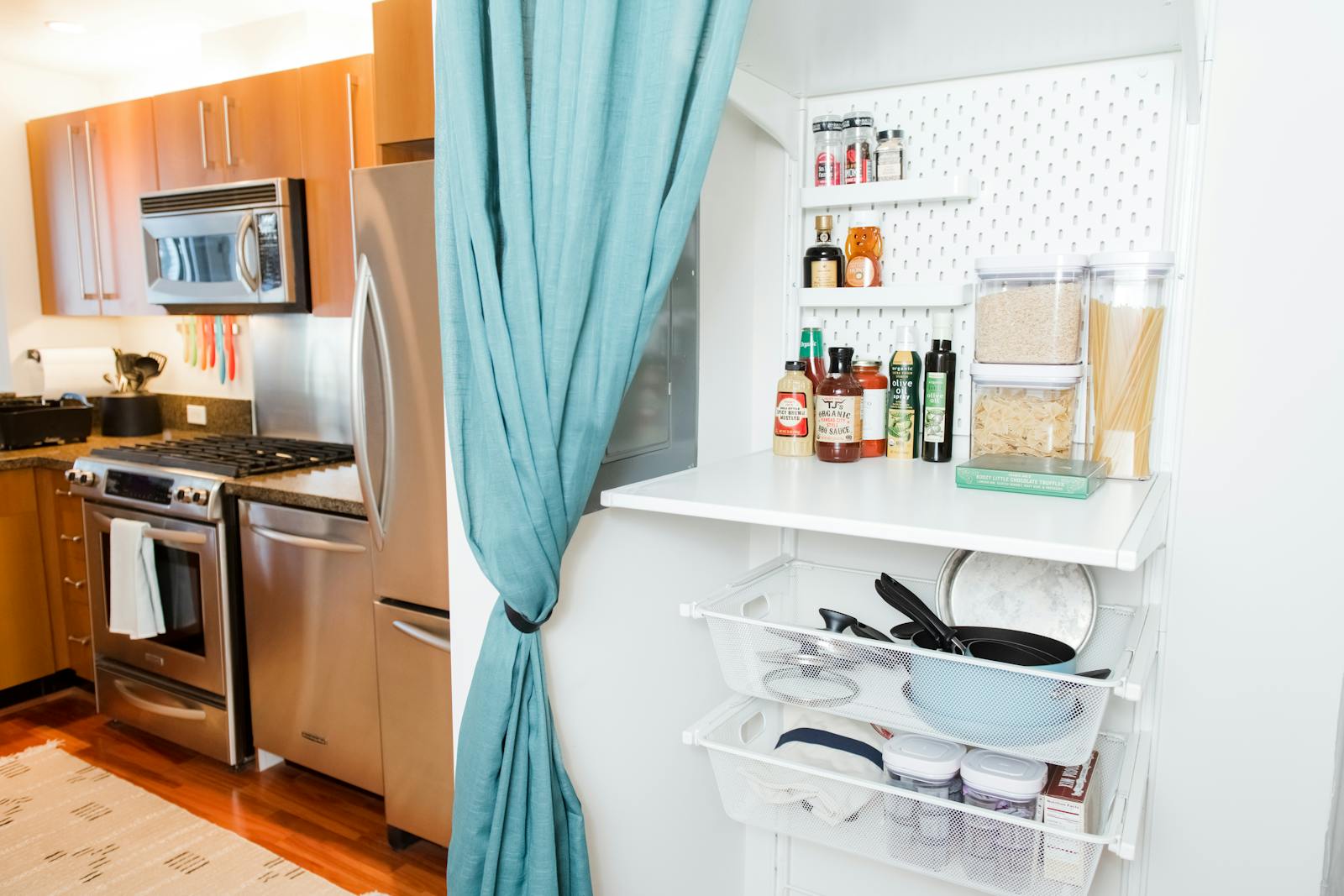 A Kitchen With A Pantry And A Microwave